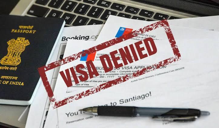 Couple reviewing K1 visa denial reasons and documents